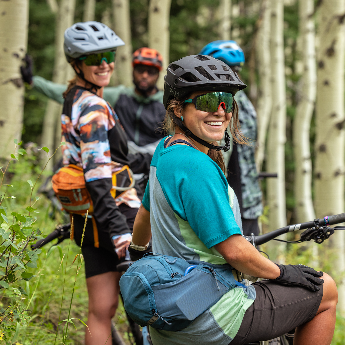 Smartwool mountain bikers on a trail